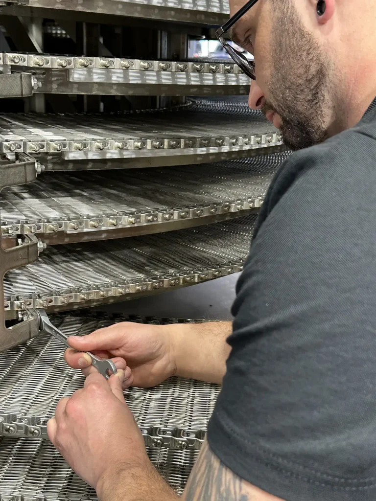 Lifecycle Service Tech working on a spiral oven